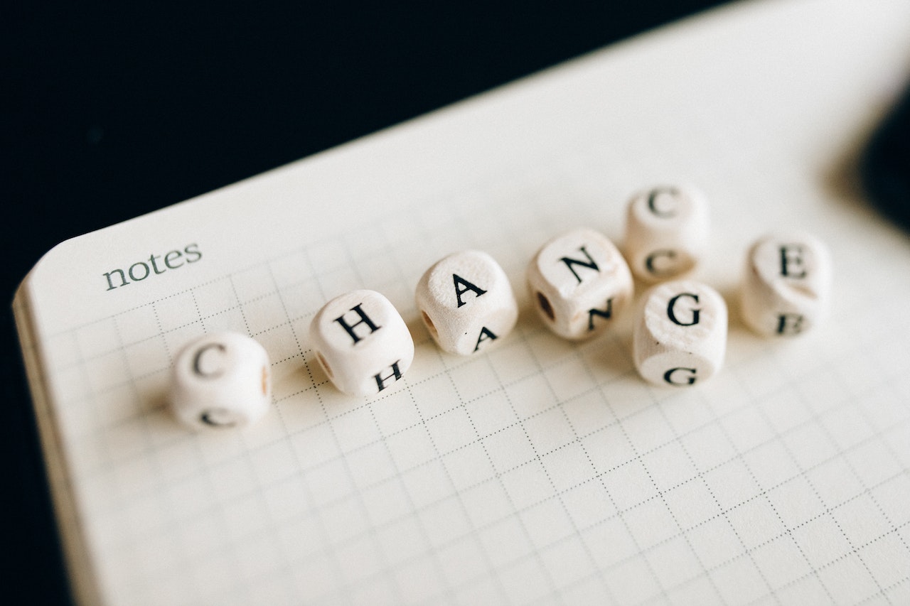 Image for the article "Dealing with Change" shows a some dice with letters on the sides building the word/s change and chance