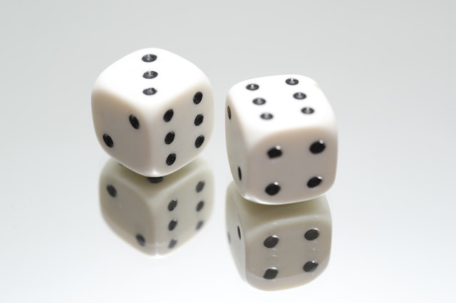 Image for the article "Dealing with Change" shows two dice on top of a mirror